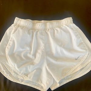 White Nike running shorts